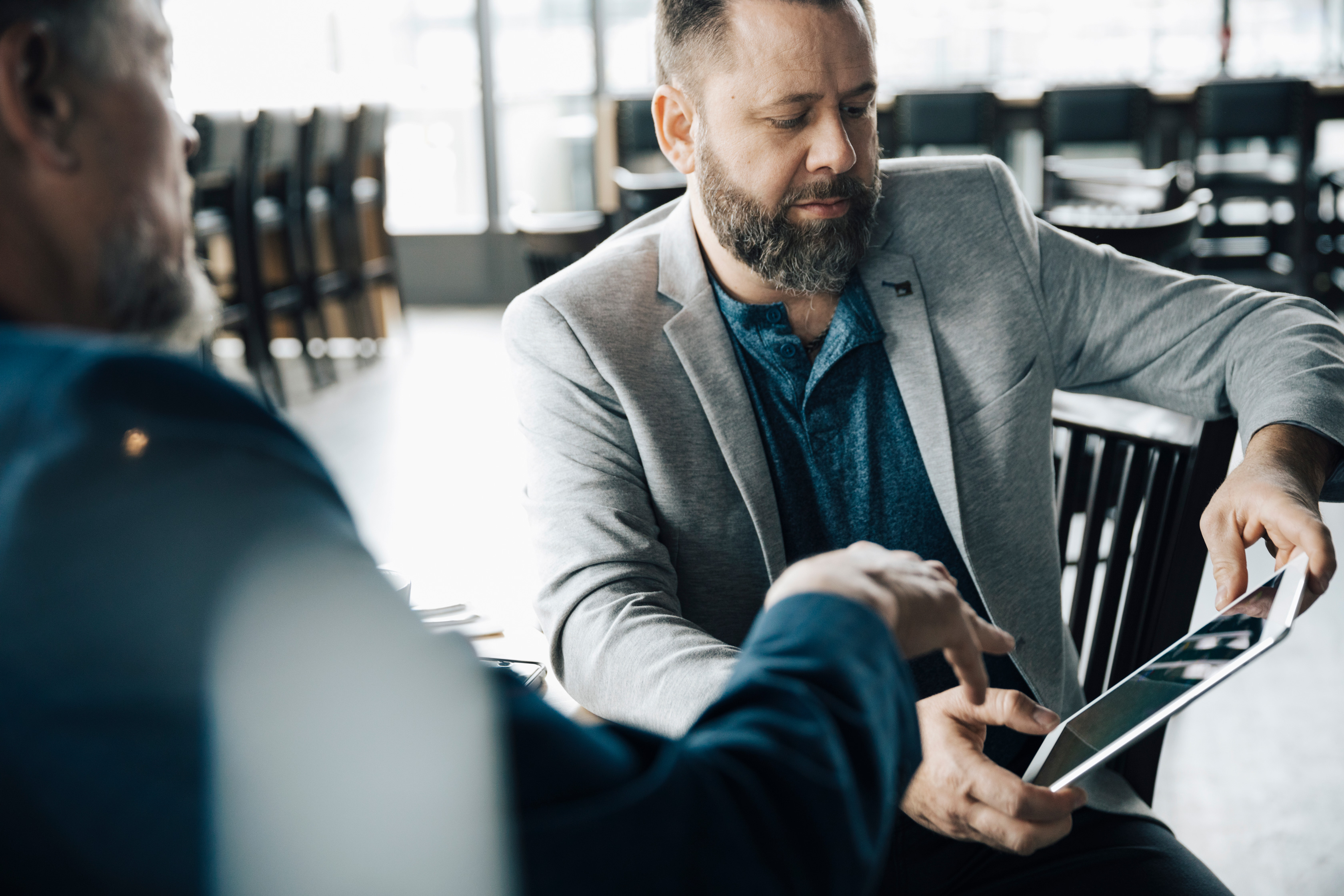 Businessmen Using Digital Tablet