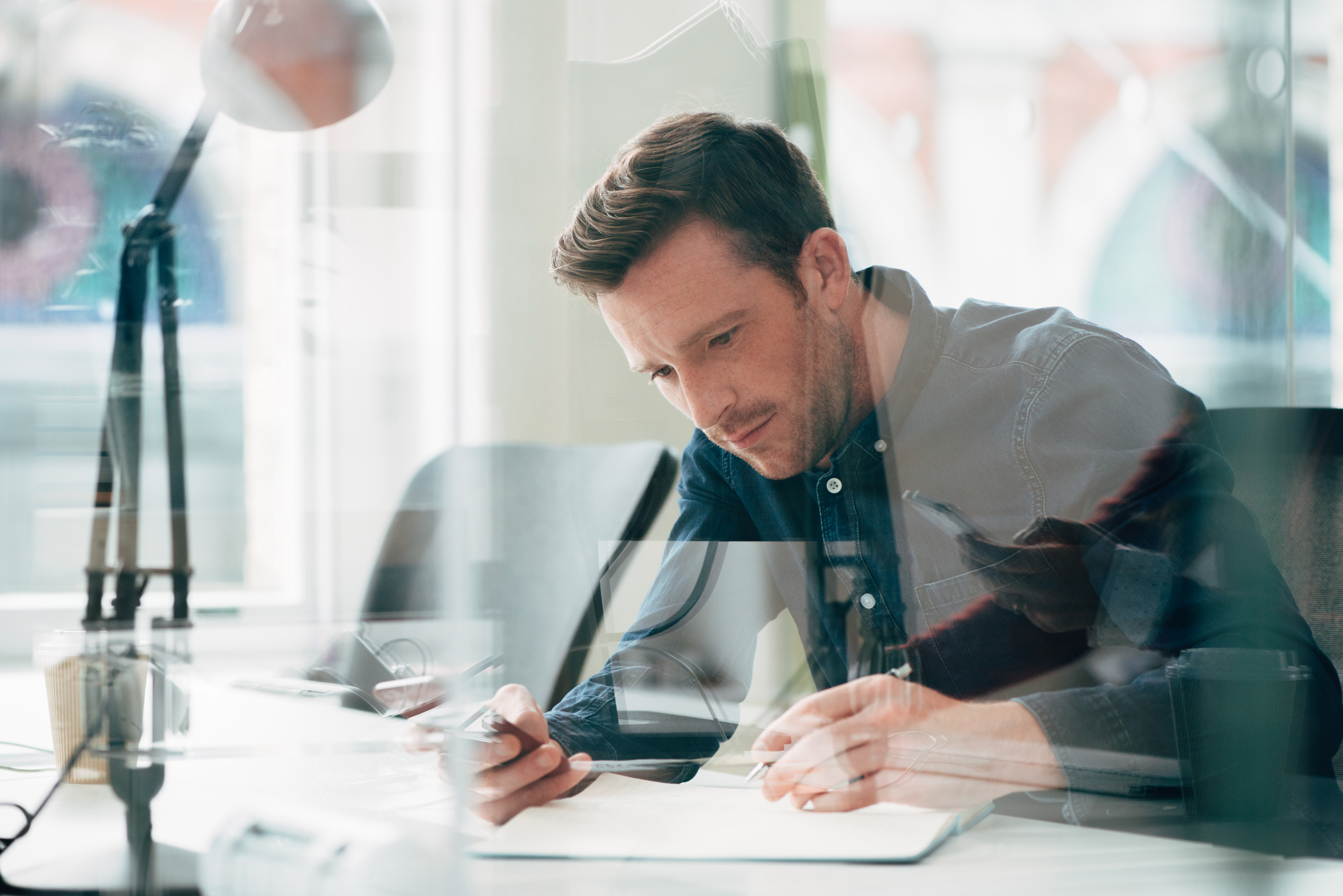 Businessman Using Laptop At Work