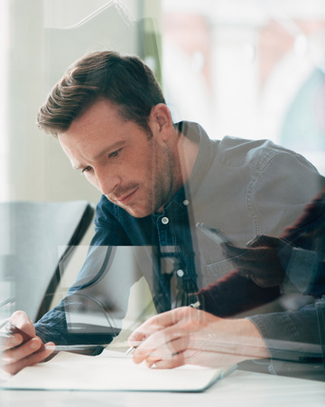 Businessman Using Laptop At Work